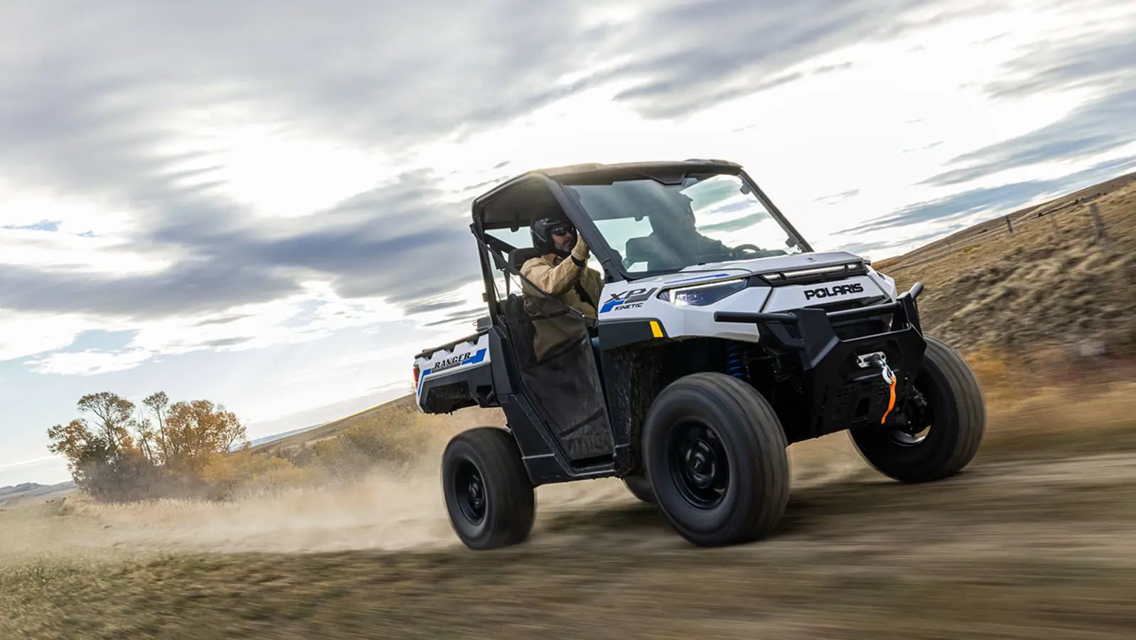 ranger xp kinetic side by side speeding down a trail