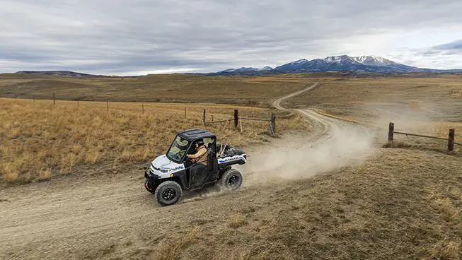 ranger xp kinetic utv kicking up dust on a trail