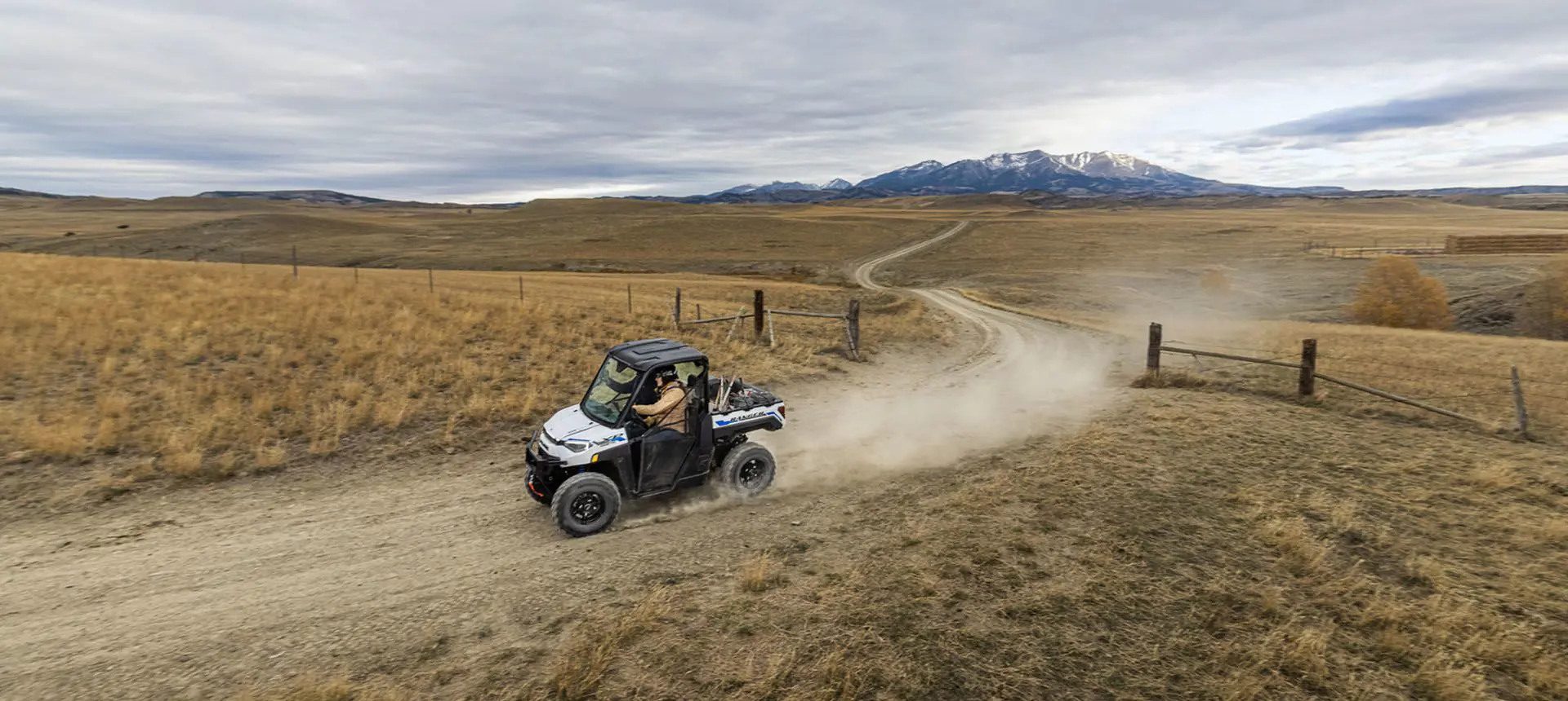 ranger xp kinetic utv kicking up dust on a trail