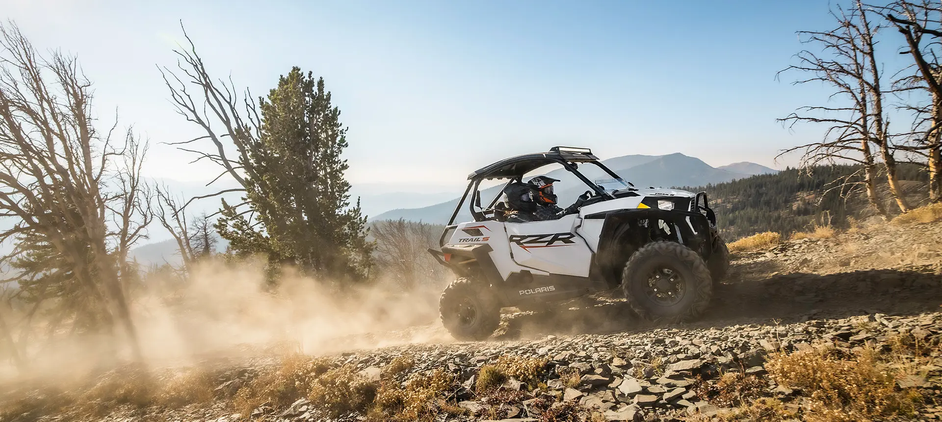 RZR trail cruising up a rocky hillside