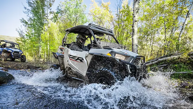 RZR trail driving through standing water