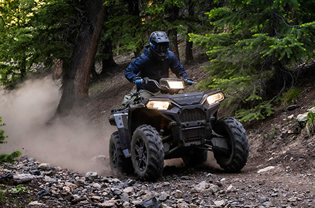polaris sportsman 850 riders traversing comfortably with independent rear suspension