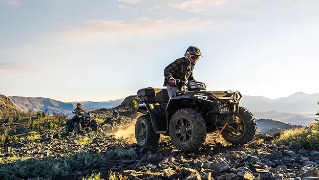 polaris sportsman 850 riders traversing comfortably with independent rear suspension