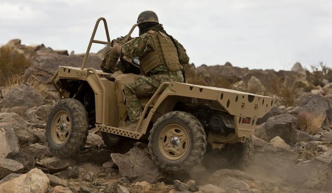 soldier driving a sportsman mv850 tactical atv on rough terrain