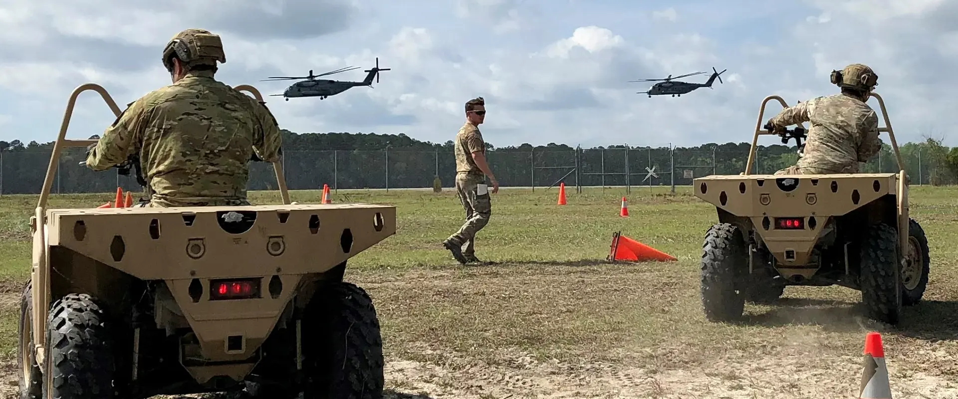 Two military training in their vehicles