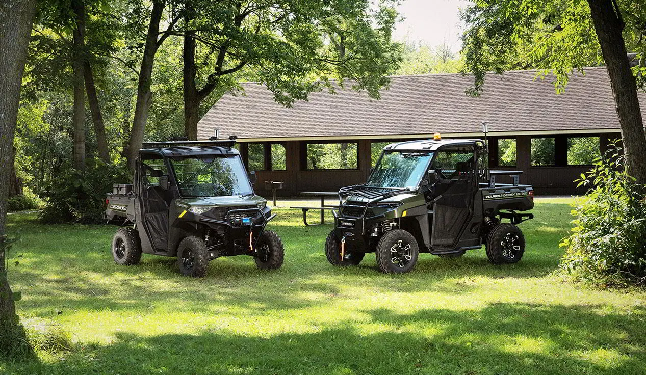 2 polaris rangers with terrain and wildlife management packages in a park