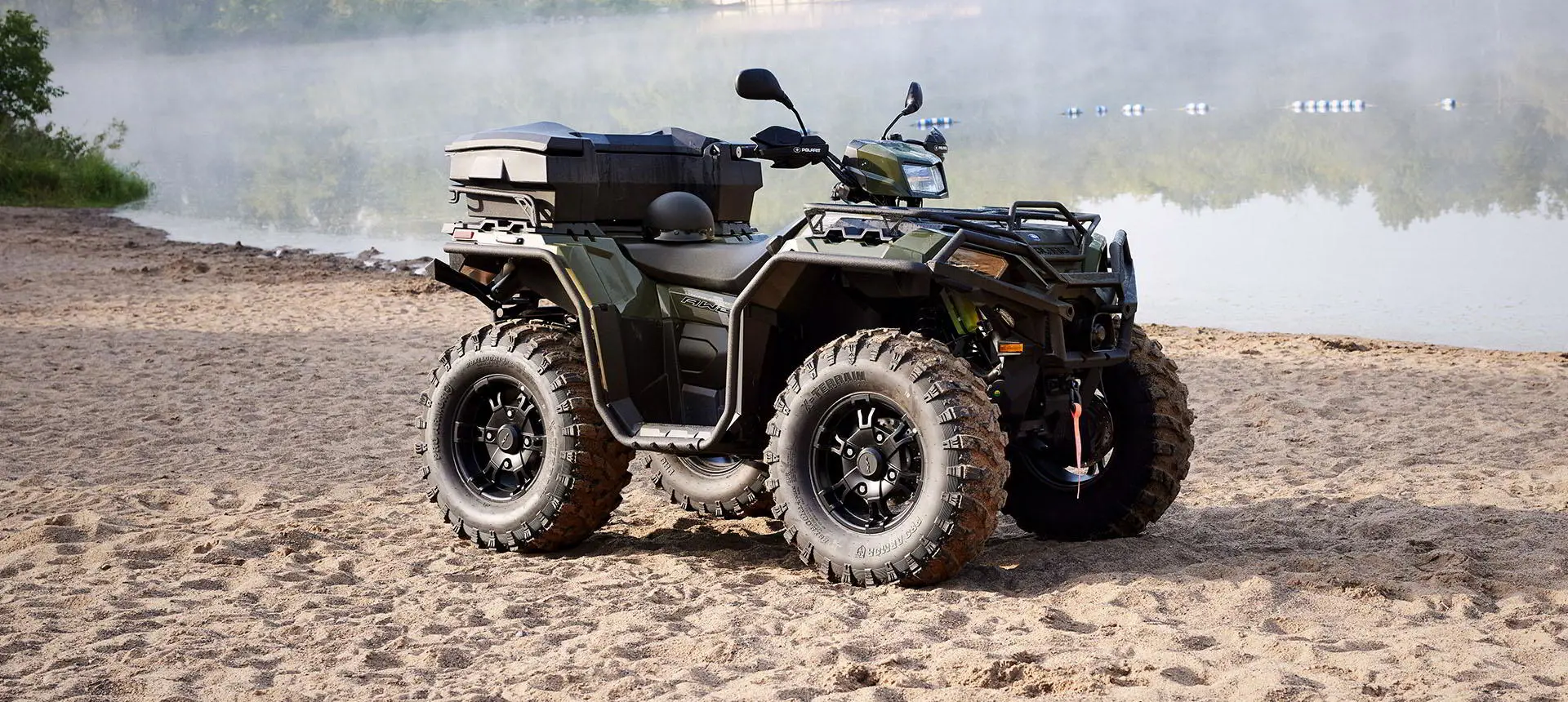 polaris sportsman with terrain and wildlife management package on a beach
