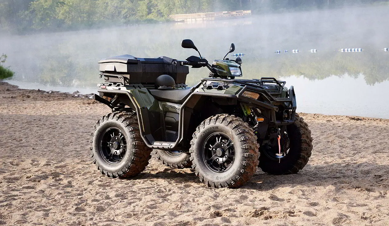 polaris sportsman with terrain and wildlife management package on a beach