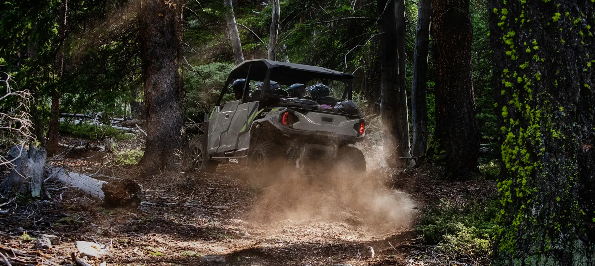 rear view of a general xp 1000 side by side utv in a forest