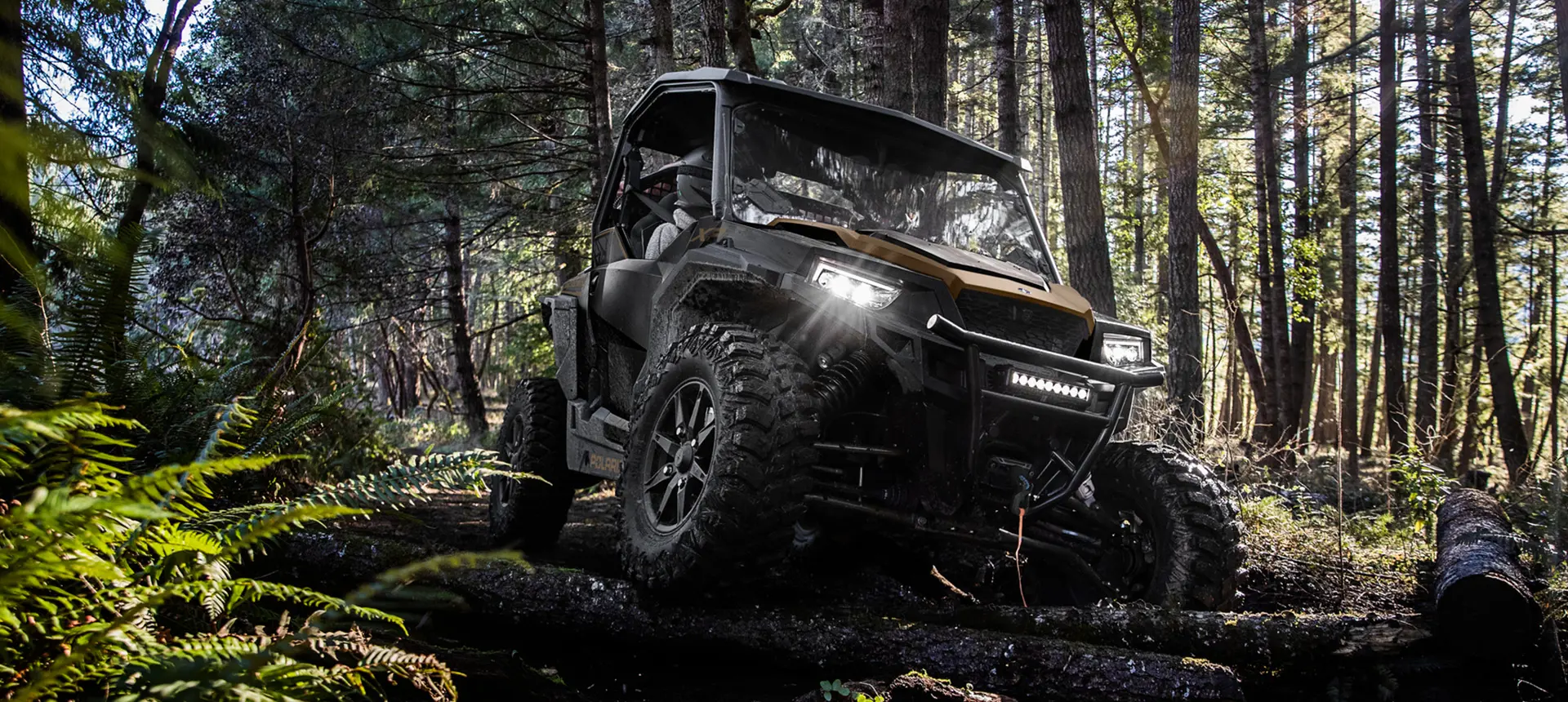 front view of a general xp 1000 side by side utv in a forest