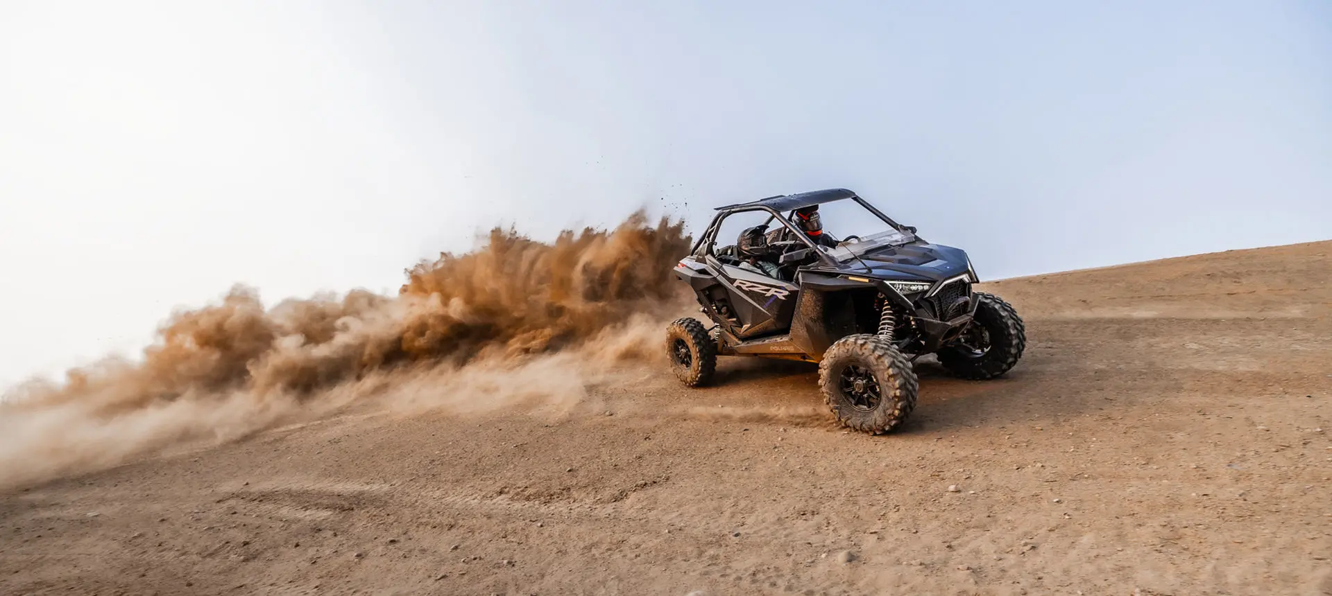 rzr pro xp side by side driving through the desert