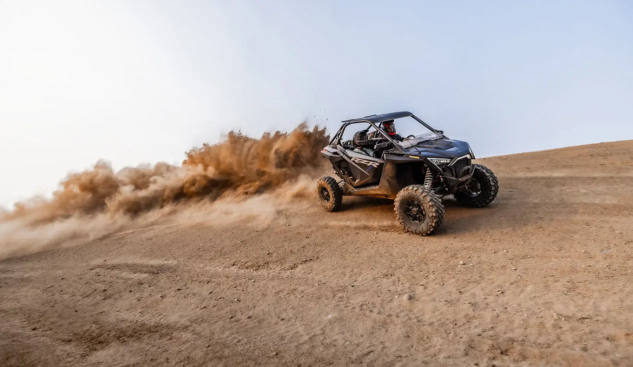 rzr pro xp side by side driving through the desert