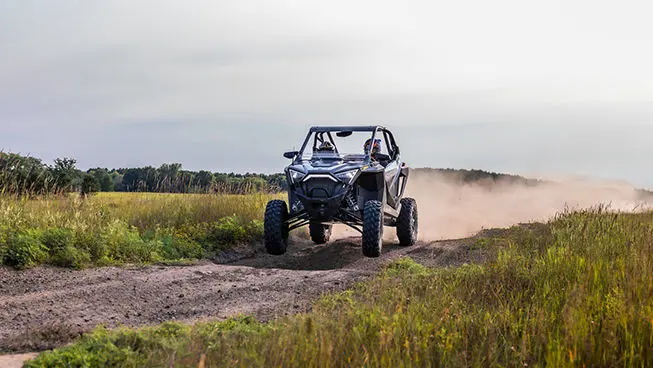 rzr pro xp side by side cruising down a trail