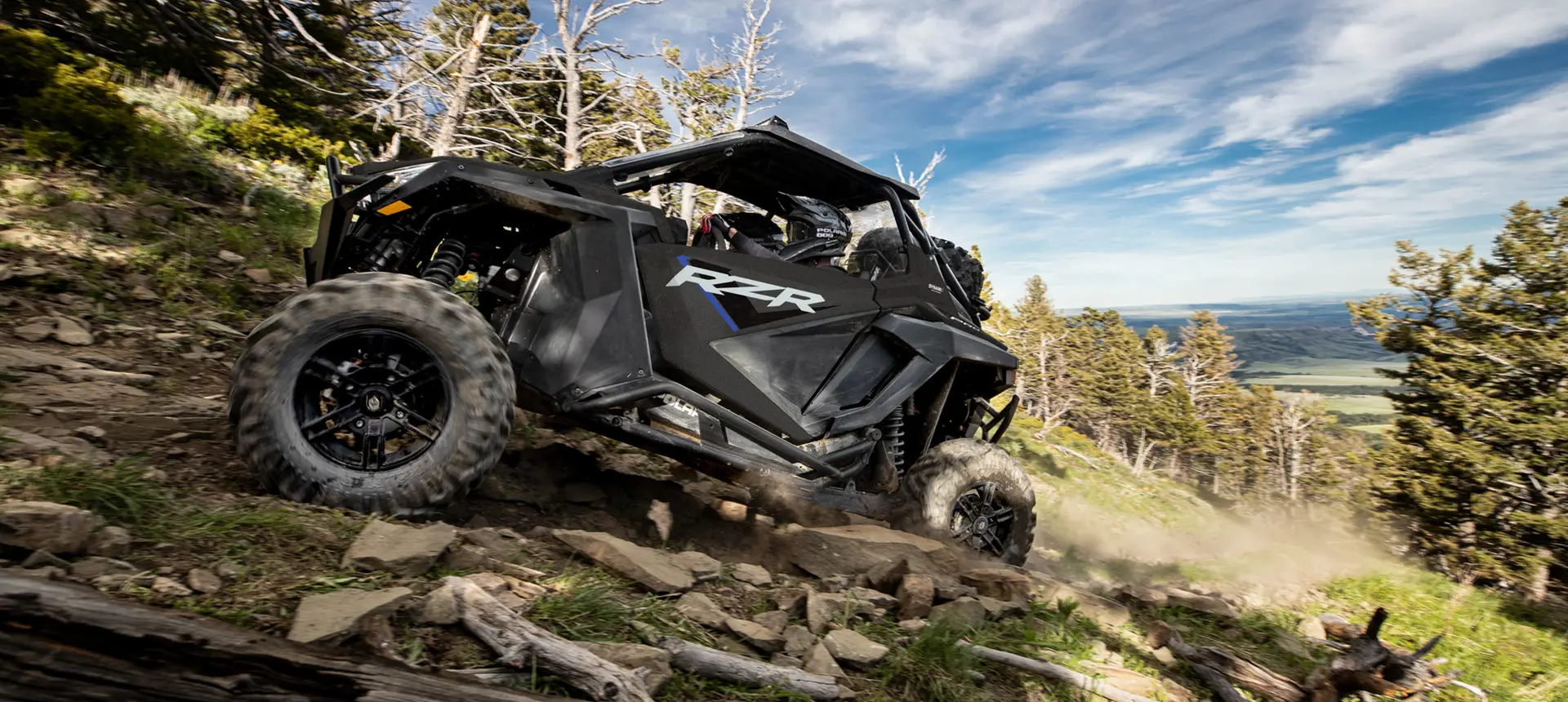 side profile of a rzr pro xp side by side on a rocky trail
