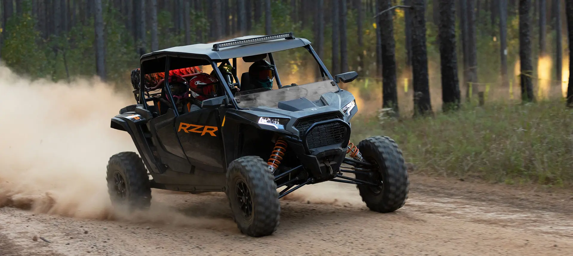 RZR XP 4 cruising down a trail