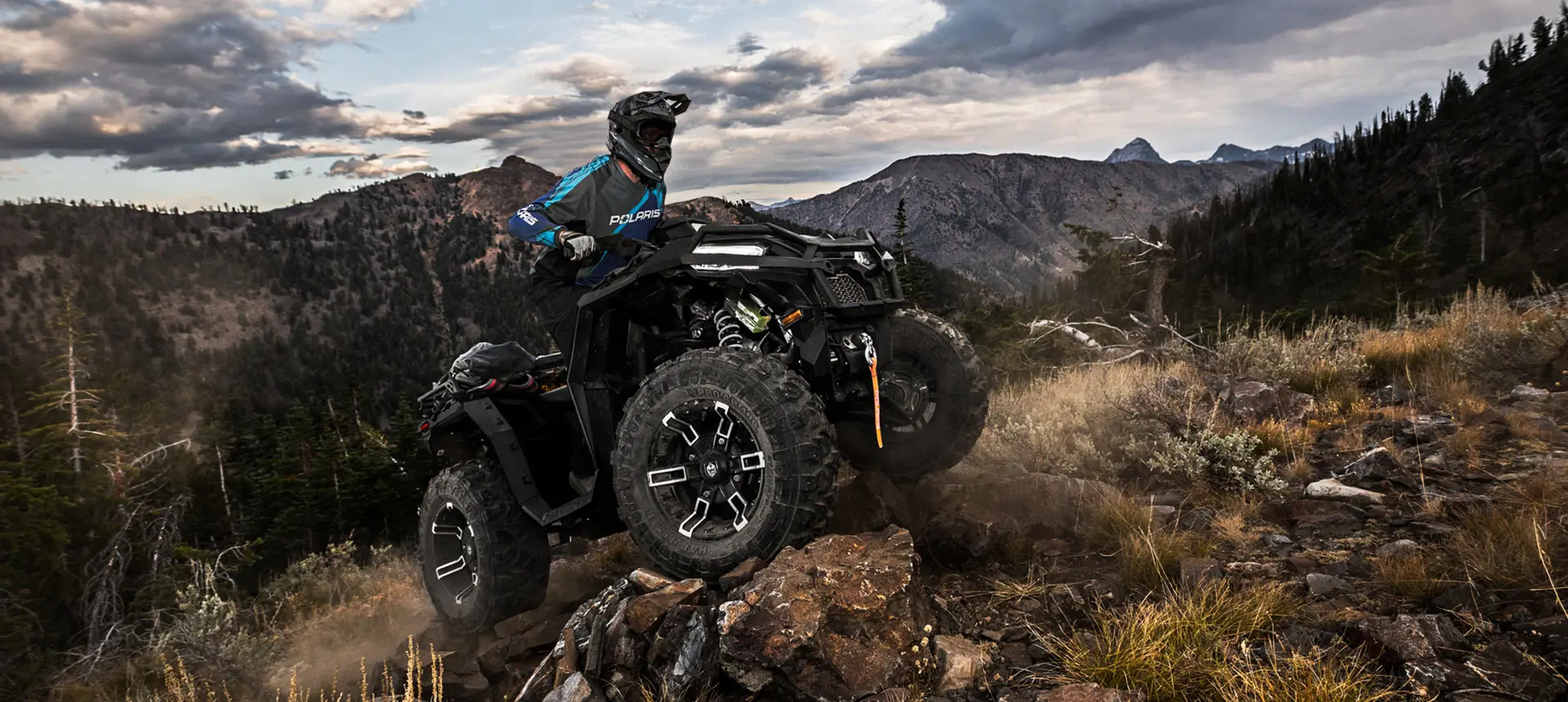 sportsman xp 1000 atv powering over rocky terrain with ease