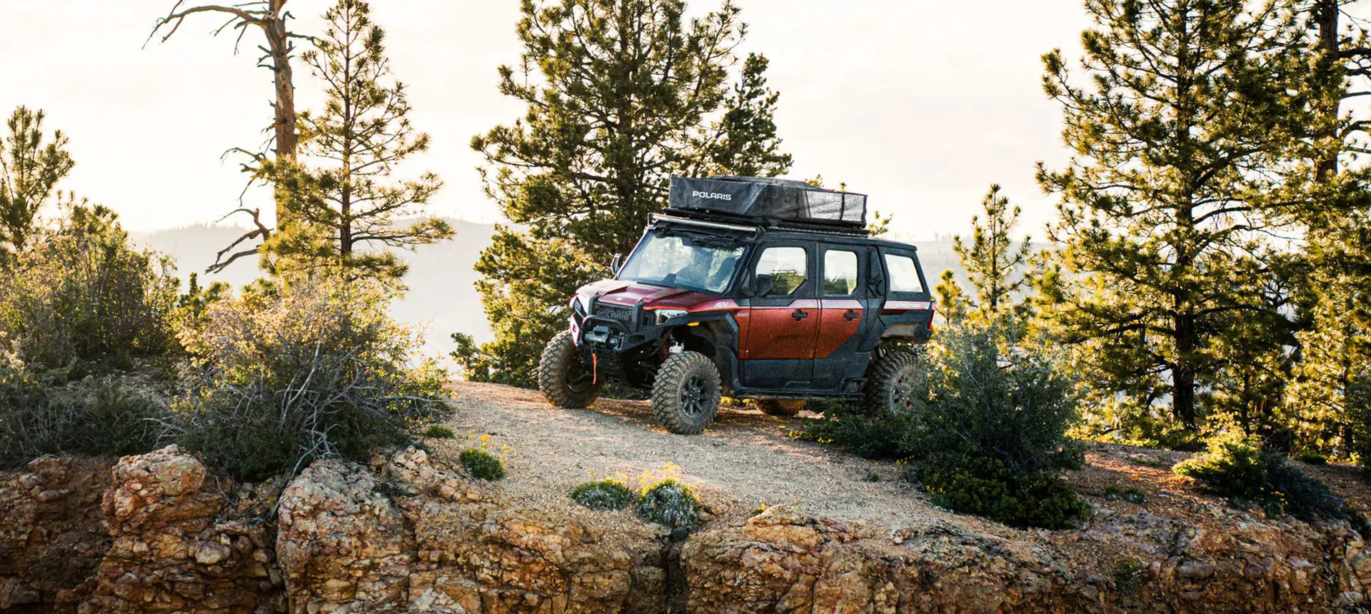polaris xpedition adv 5 northstar side by side parked on a hill