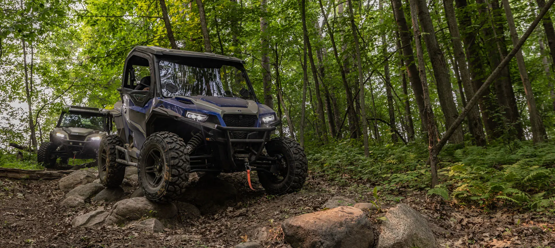 GENERAL XP 1000s on a rocky forest trail