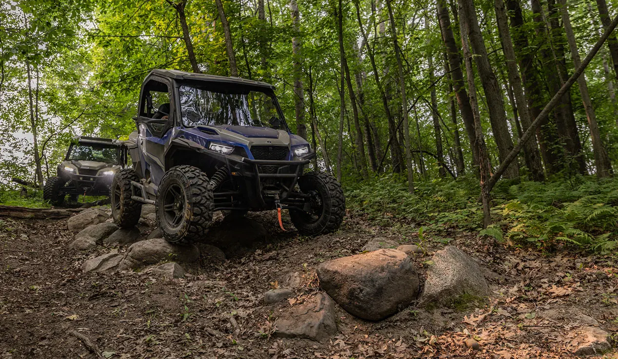 GENERAL XP 1000s on a rocky forest trail