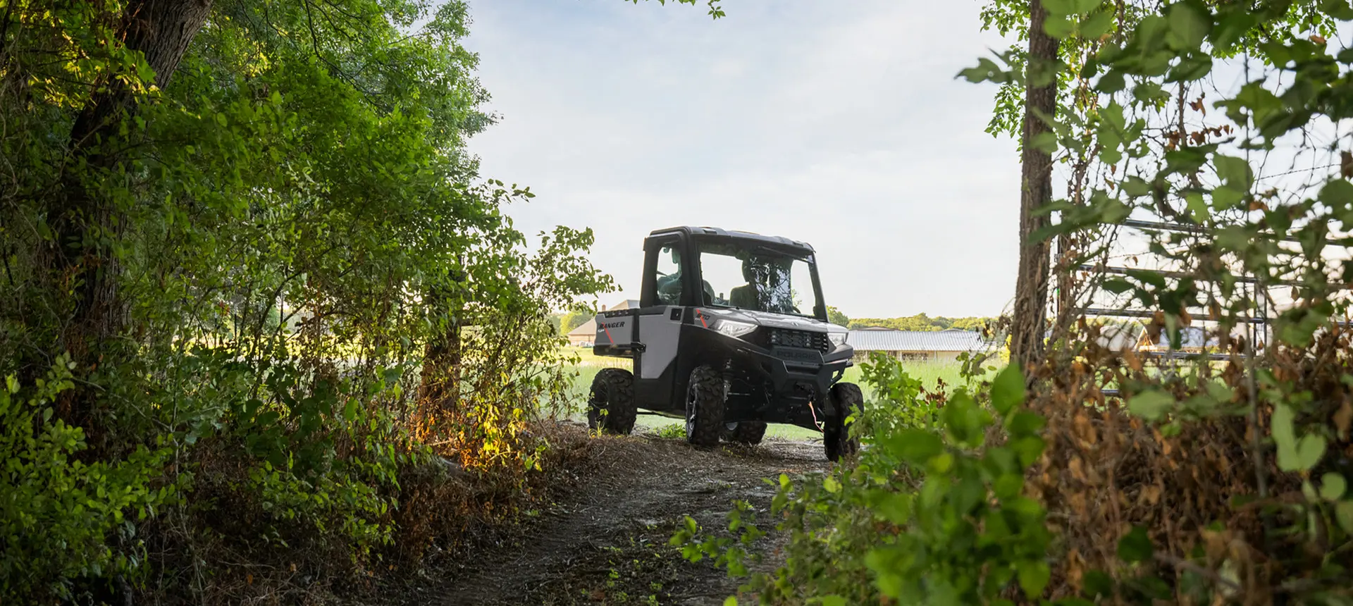 RANGER SP 570 NorthStar Edition turning onto a forest trail