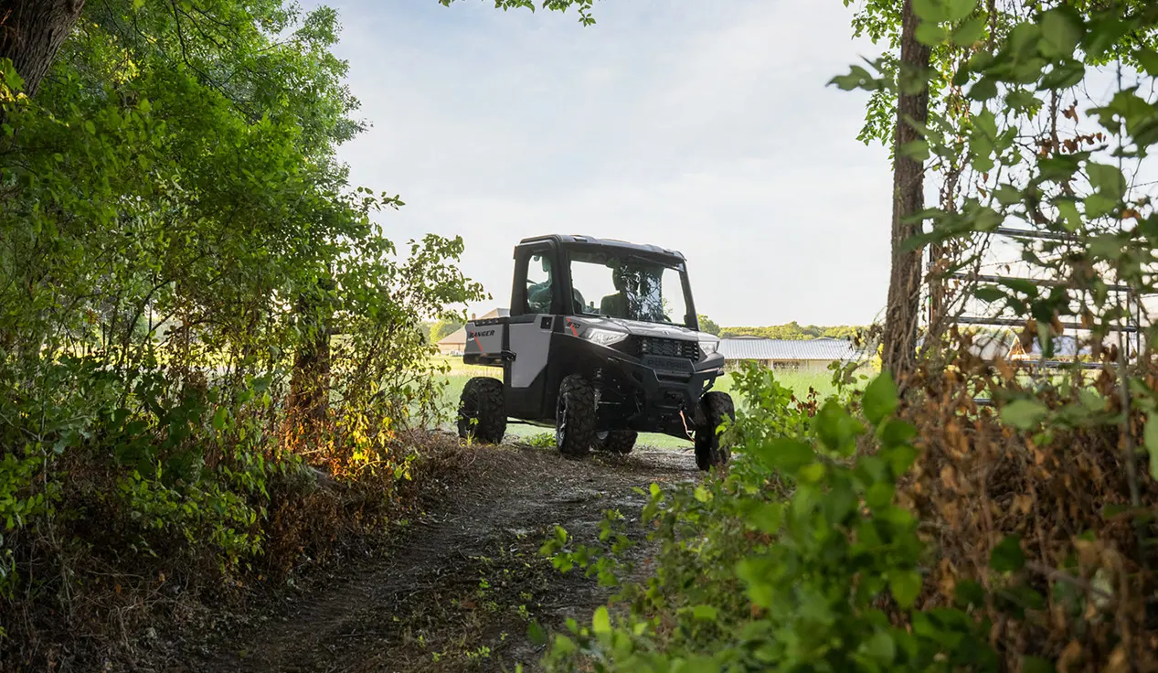 RANGER SP 570 NorthStar Edition turning onto a forest trail