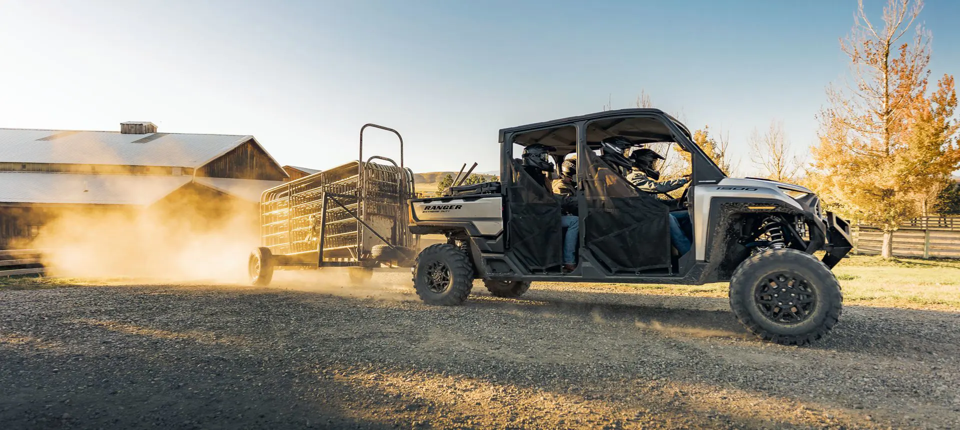 RANGER CREW XD 1500 extreme duty utv pulling a trailer on a farm with ease