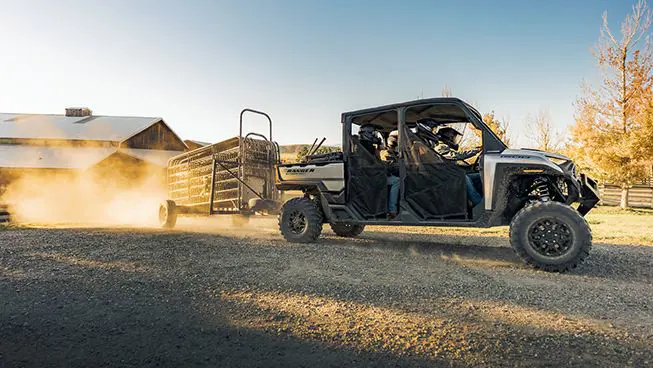 RANGER CREW XD 1500 extreme duty utv pulling a trailer on a farm with ease