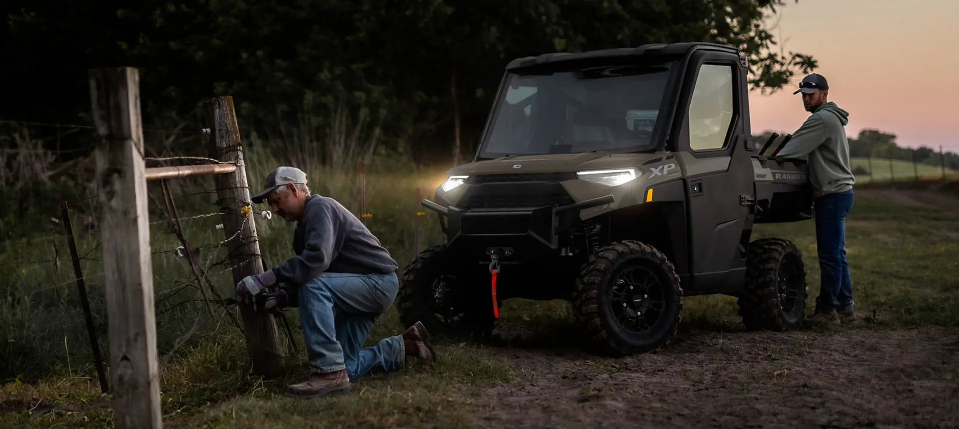 farmers fixing fence in the light of their RANGER XP 1000 NorthStar Edition UTV