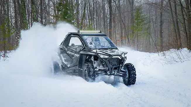 RZR Pro XP driving through the snow