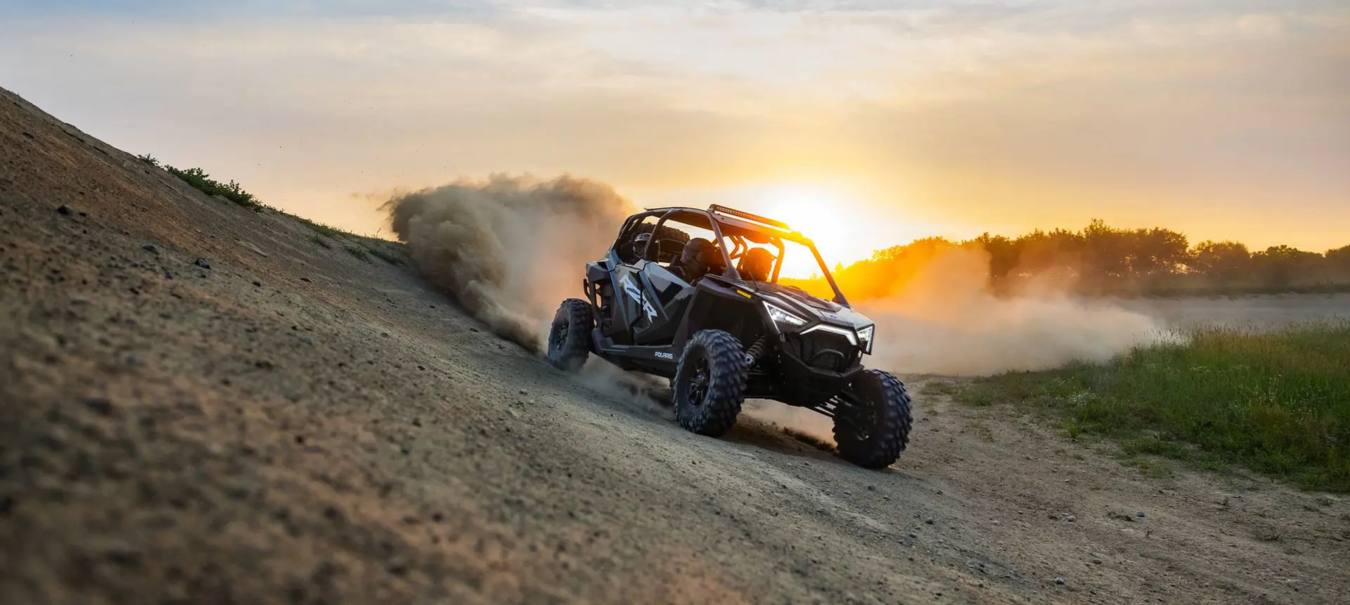 RZR Pro XP 4 driving down a hill at sunset