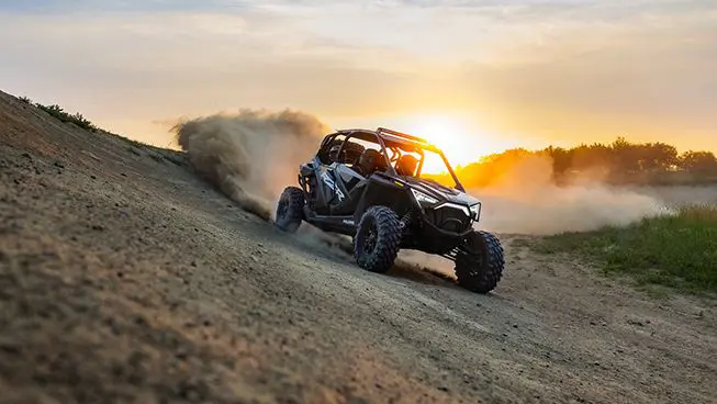 RZR Pro XP 4 driving down a hill at sunset