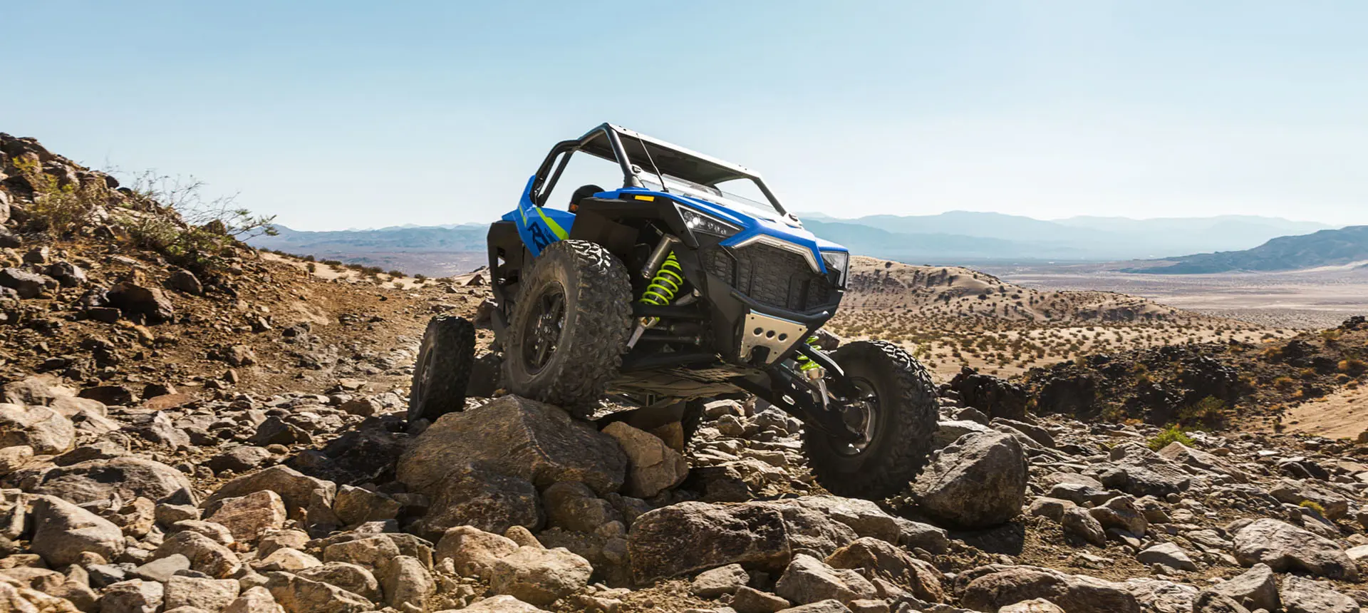 rzr turbo r side by side crawling over rocks