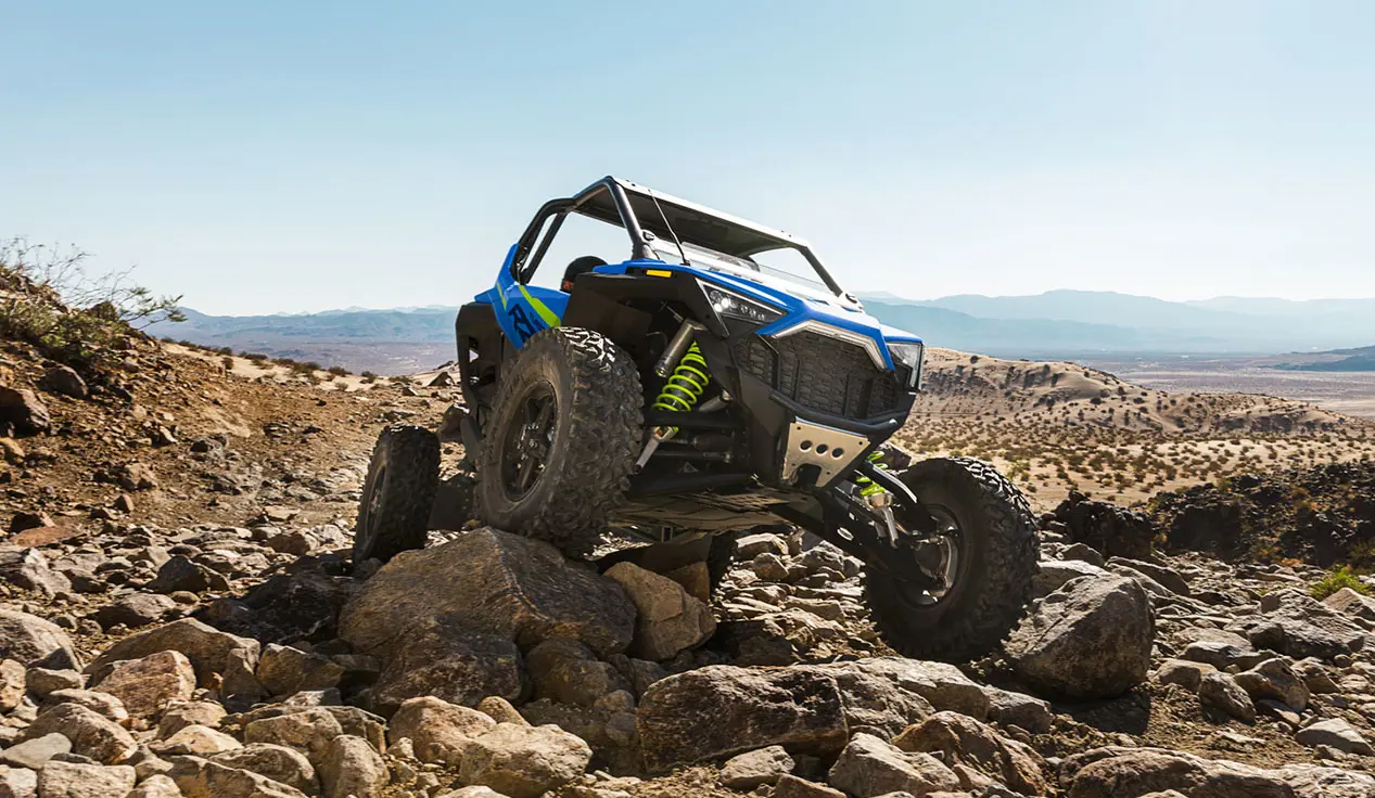 rzr turbo r side by side crawling over rocks