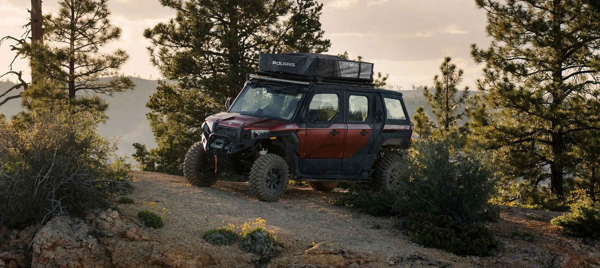 Polaris XPEDITION Adventure riding through a forest
