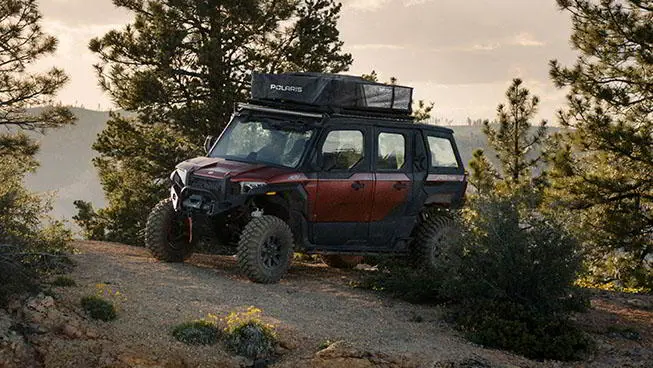 Polaris XPEDITION Adventure riding through a forest