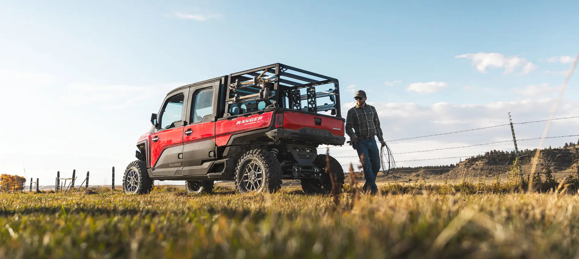 farmer fencing near a RANGER XD 1500 extreme duty utv