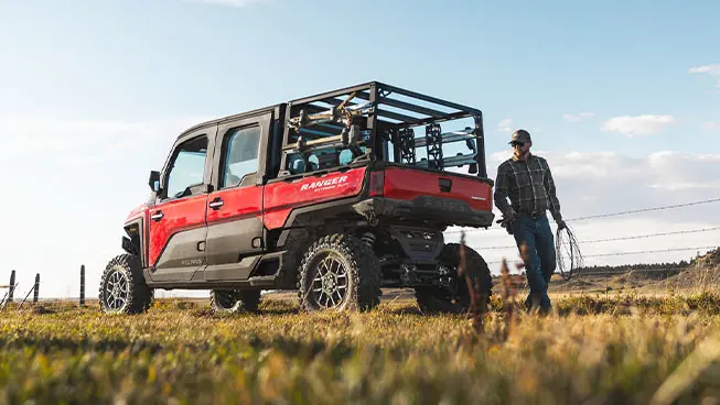 farmer fencing near a RANGER XD 1500 extreme duty utv