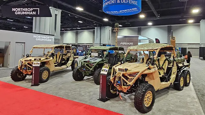 soldier riding on a polaris military 650 titan 155 snowmobile
