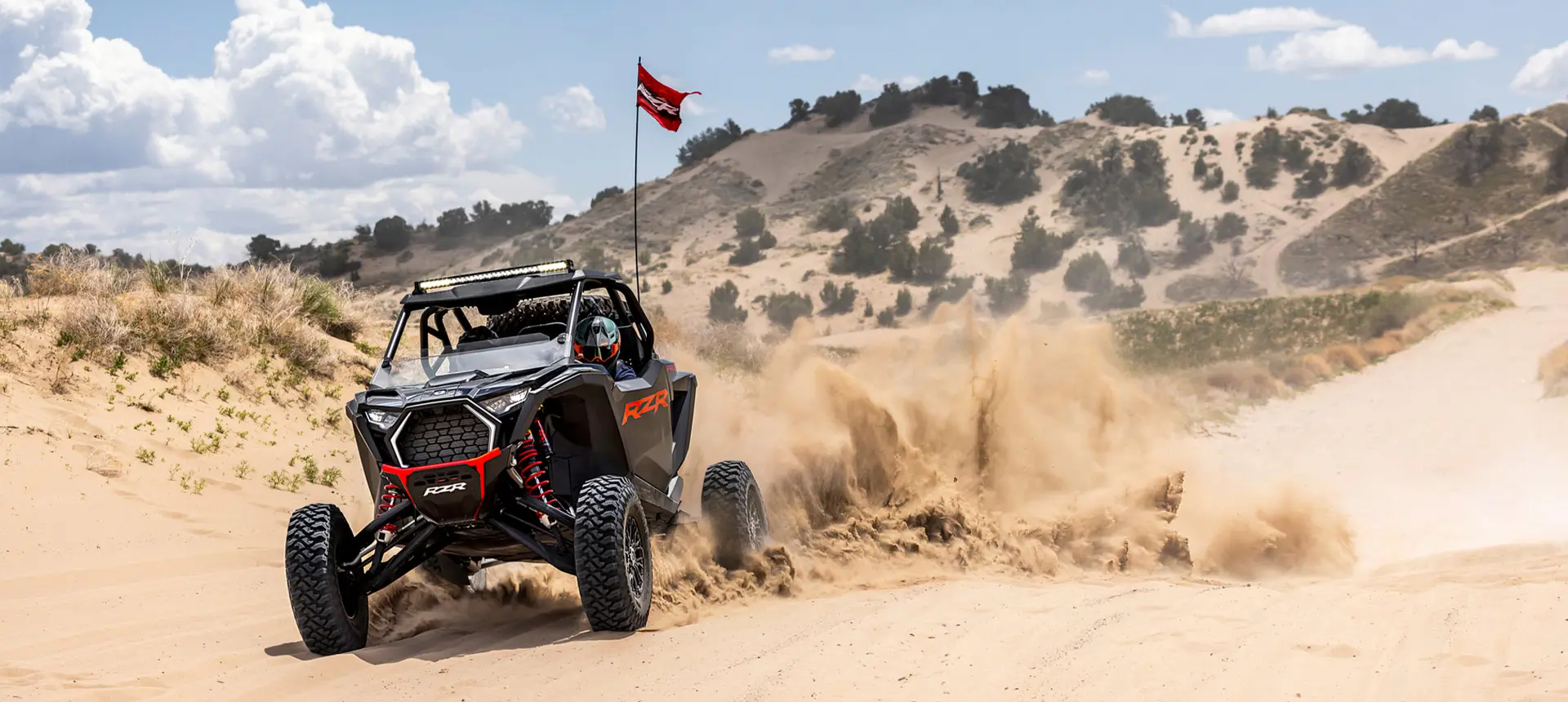 Polaris RZR Pro S side-by-side throwing sand in the desert.
