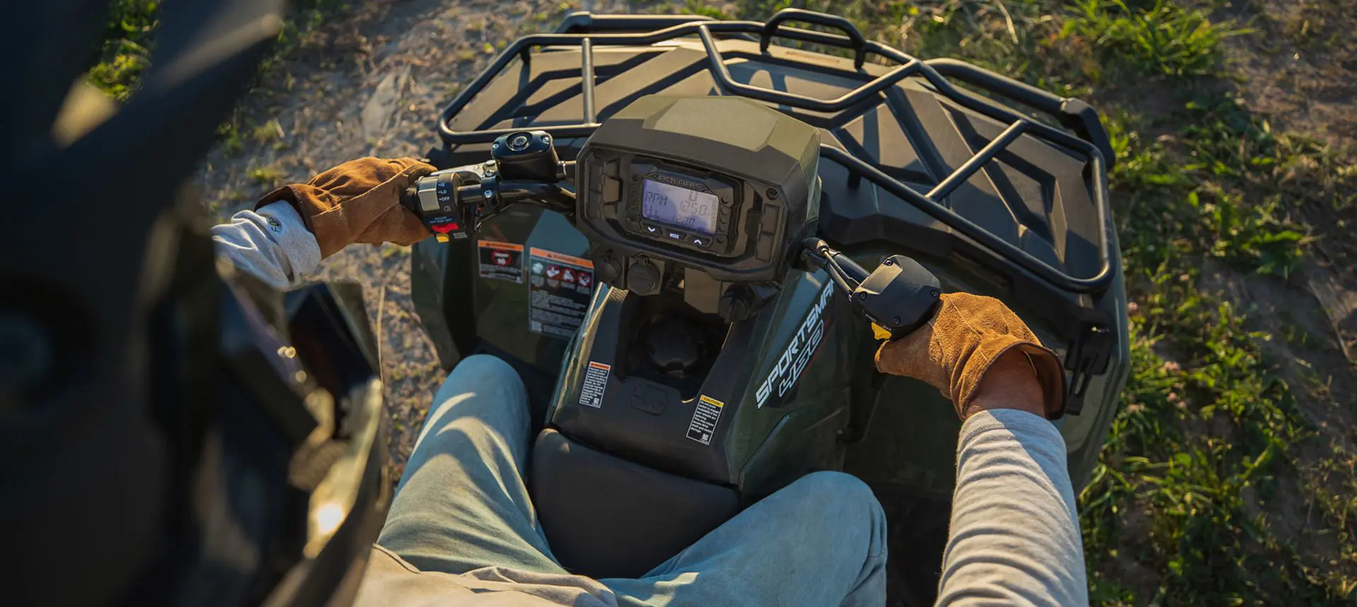 Dash on the steering of a Polaris Sportsman 450 ATV.