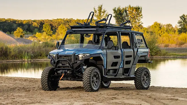 Polaris XPEDITION ADV 5 side-by-side parked near a lake.