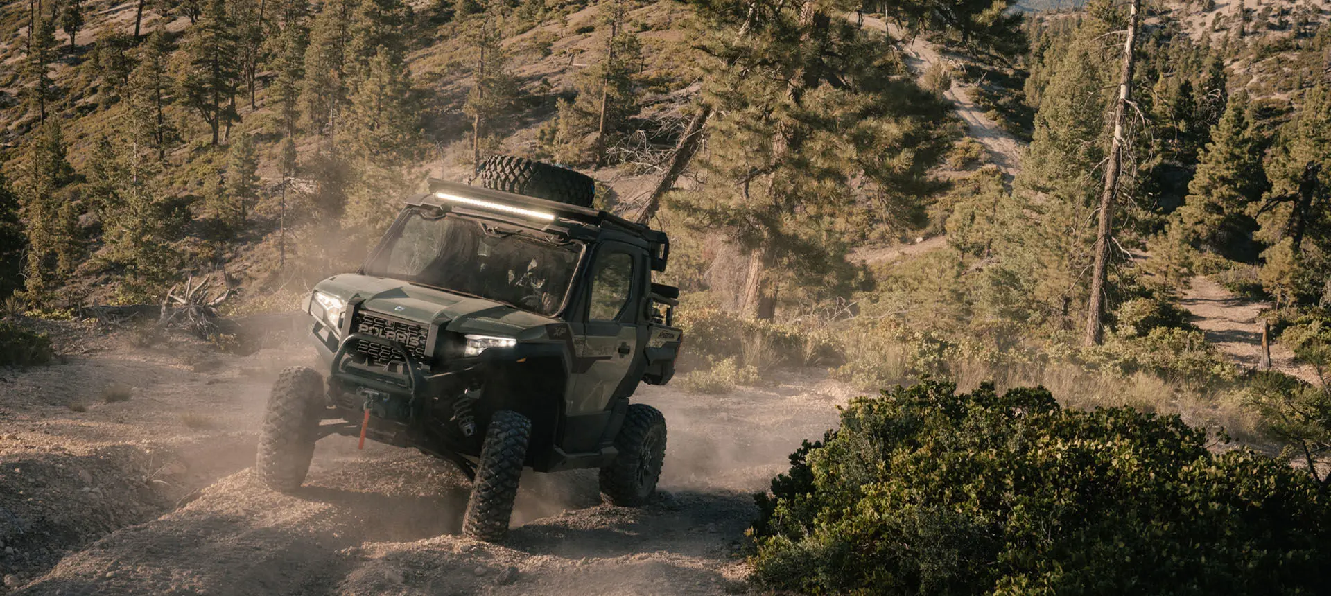 Polaris XPEDITION XP side-by-side climbing a hill.