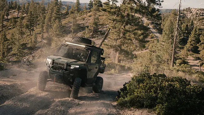 Polaris XPEDITION XP side-by-side climbing a hill.