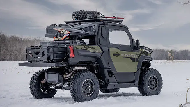 Side profile of a Polaris XPEDITION XP side-by-side with hunting accessories installed.