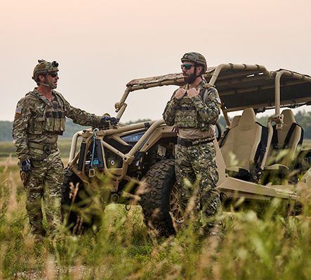 Soldiers patrolling with Polaris MRZR tactical vehicles.