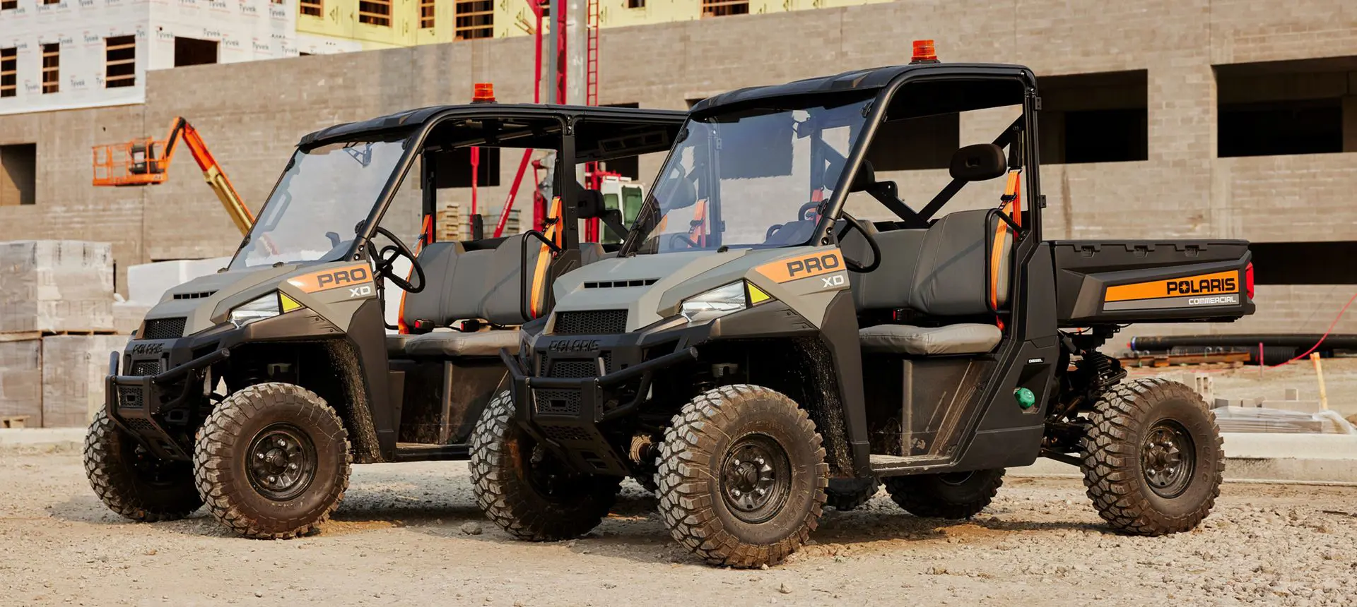 Two Polaris Pro XD Full-Size Diesel UTVs at a jobsite.