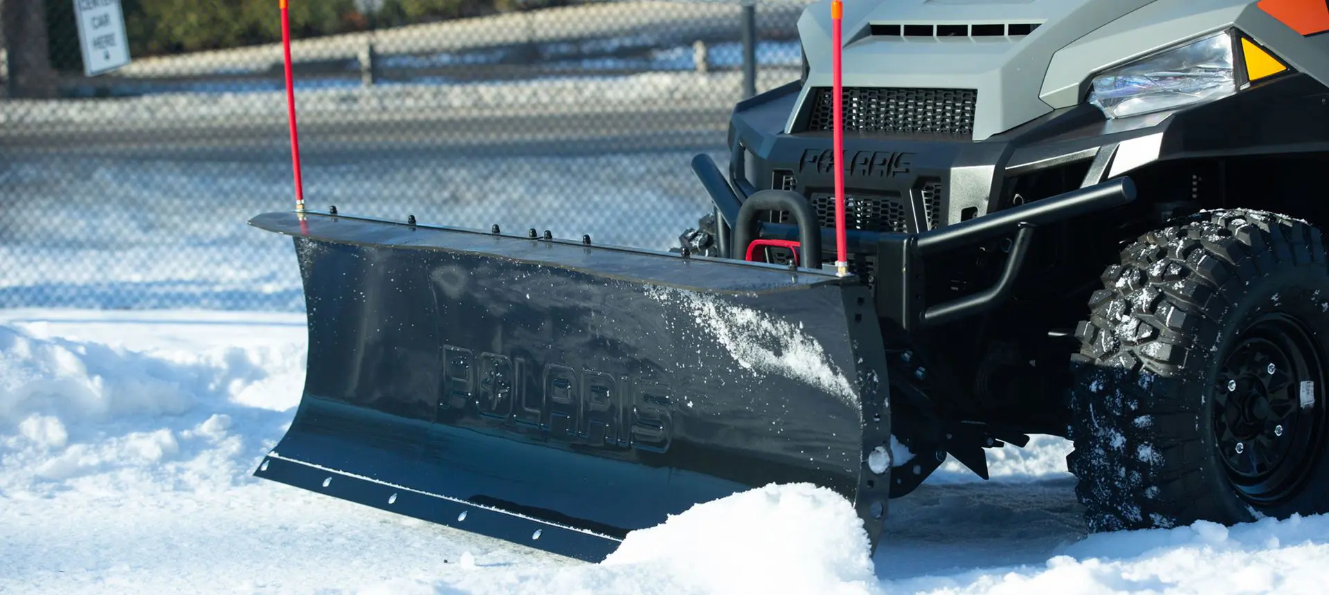 Snowplow on a Polaris Full-Size Diesel work UTV.