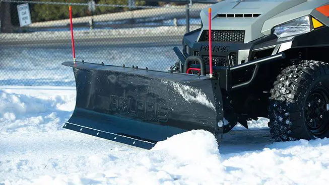 Snowplow on a Polaris Full-Size Diesel work UTV.