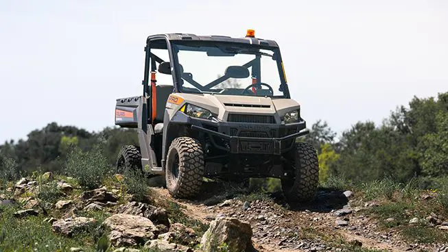 Front view of a Polaris Pro XD Full-Size diesel work UTV on a hill.