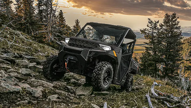 Polaris RANGER 1000 UTV driving over rocky terrain with ease.